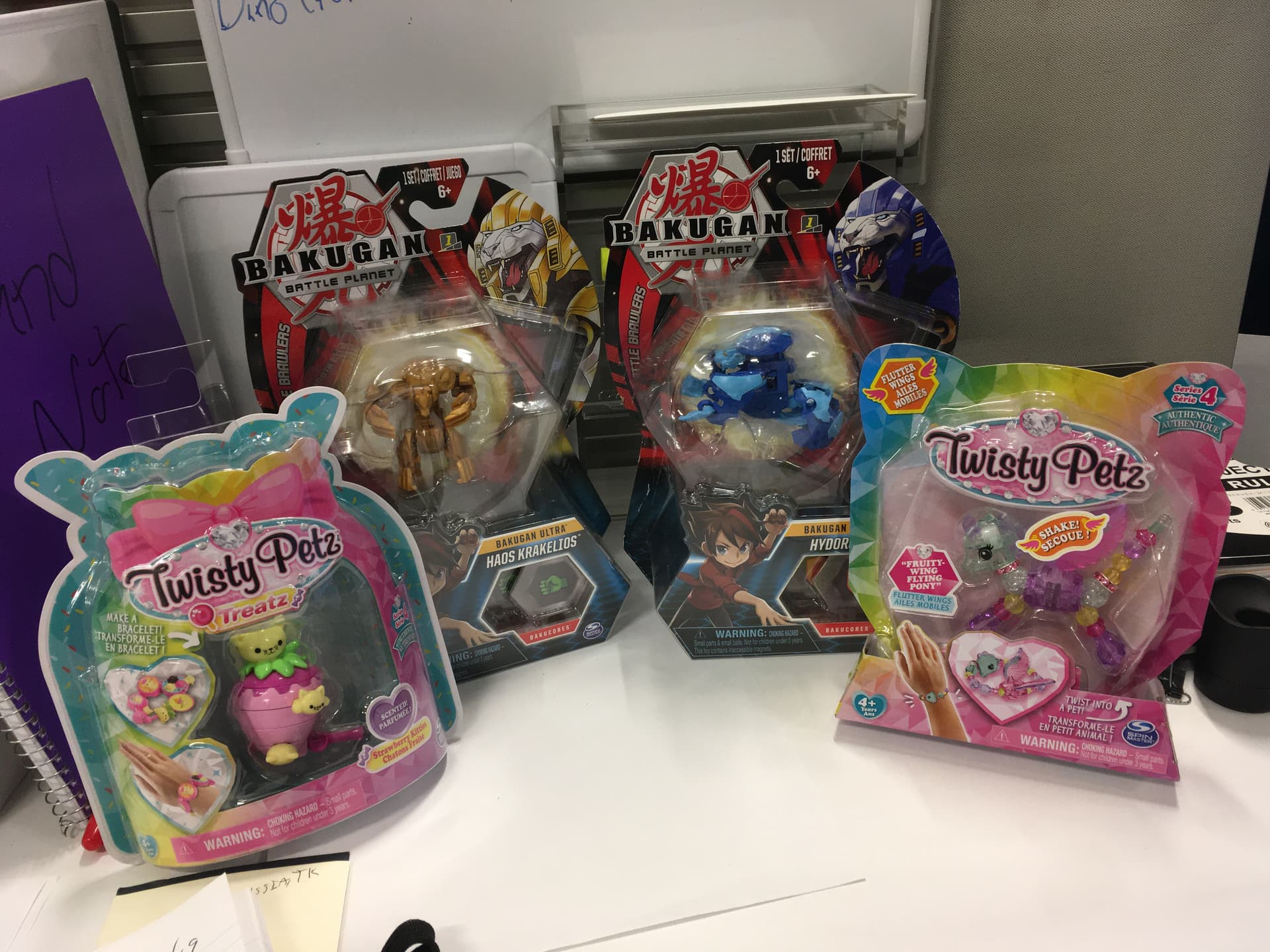Finished Bakugan and Twisty Petz retail product at the desk during production review