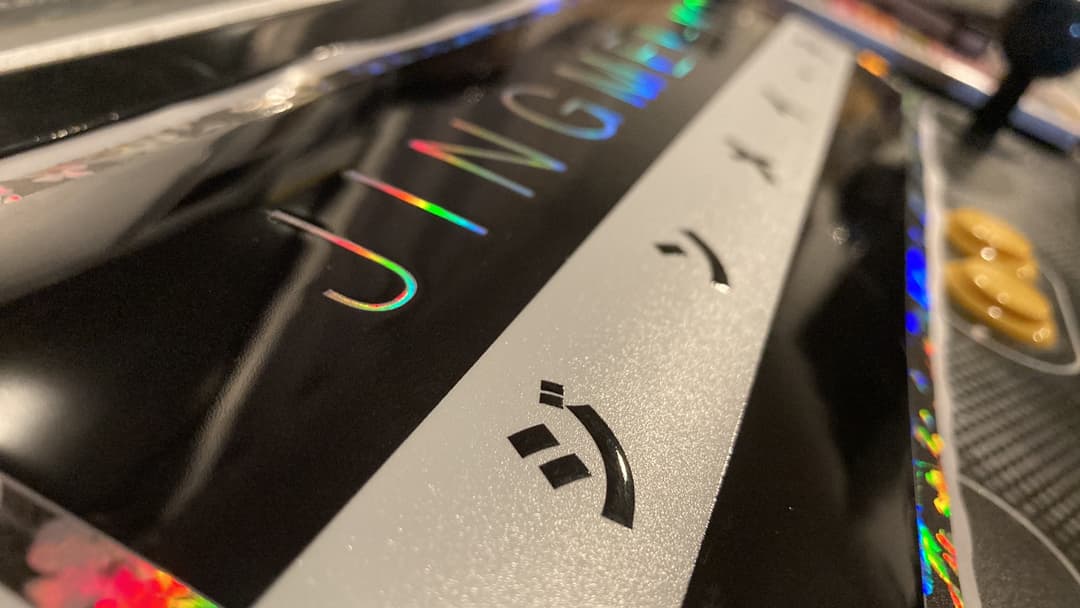 Close-up of holographic foil and spot UV finishing